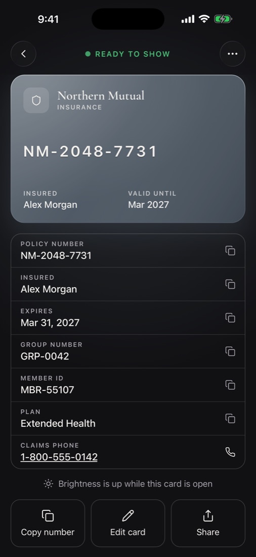 An insurance card with its policy number, group number and a claims phone number to tap
